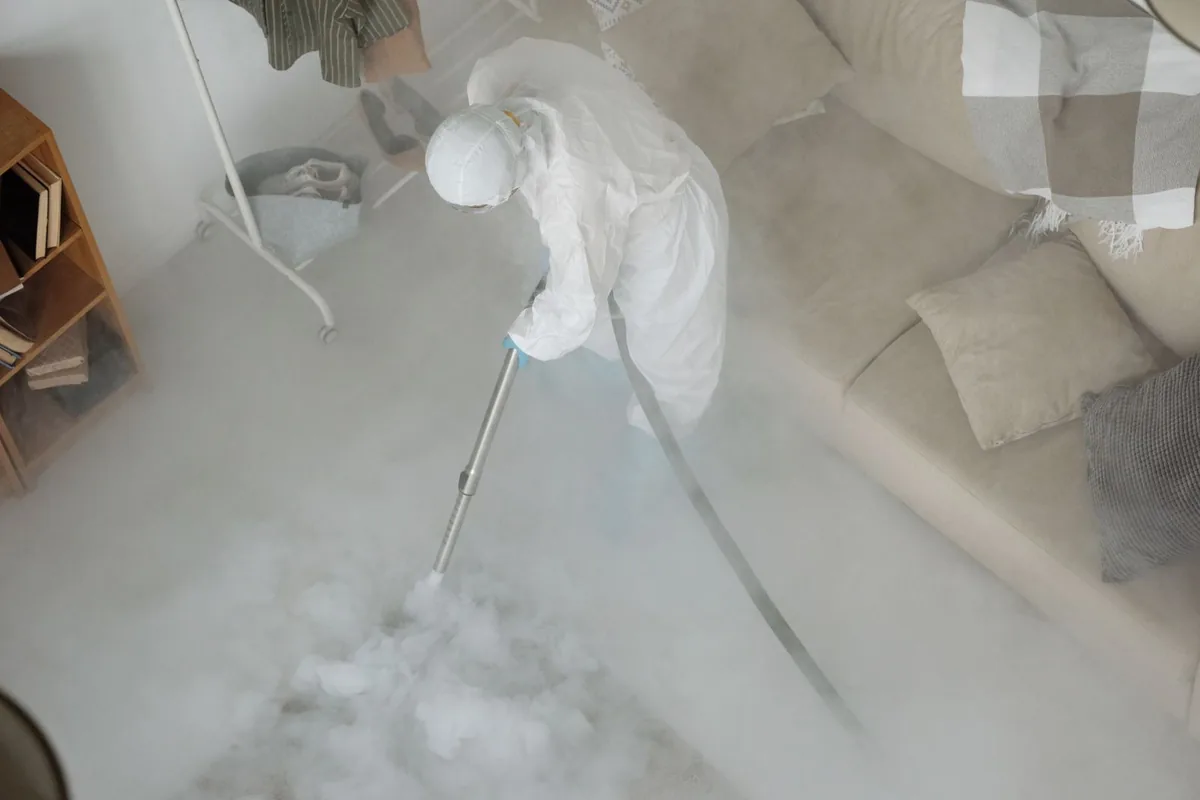 Biohazard cleanup technician in protective equipment, Serenada, TX